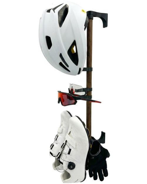 Product rack with a white helmet, two pairs of sunglasses, a pair of black gloves, and a pair of white cycling shoes mounted on it. Viewed from a side angle.