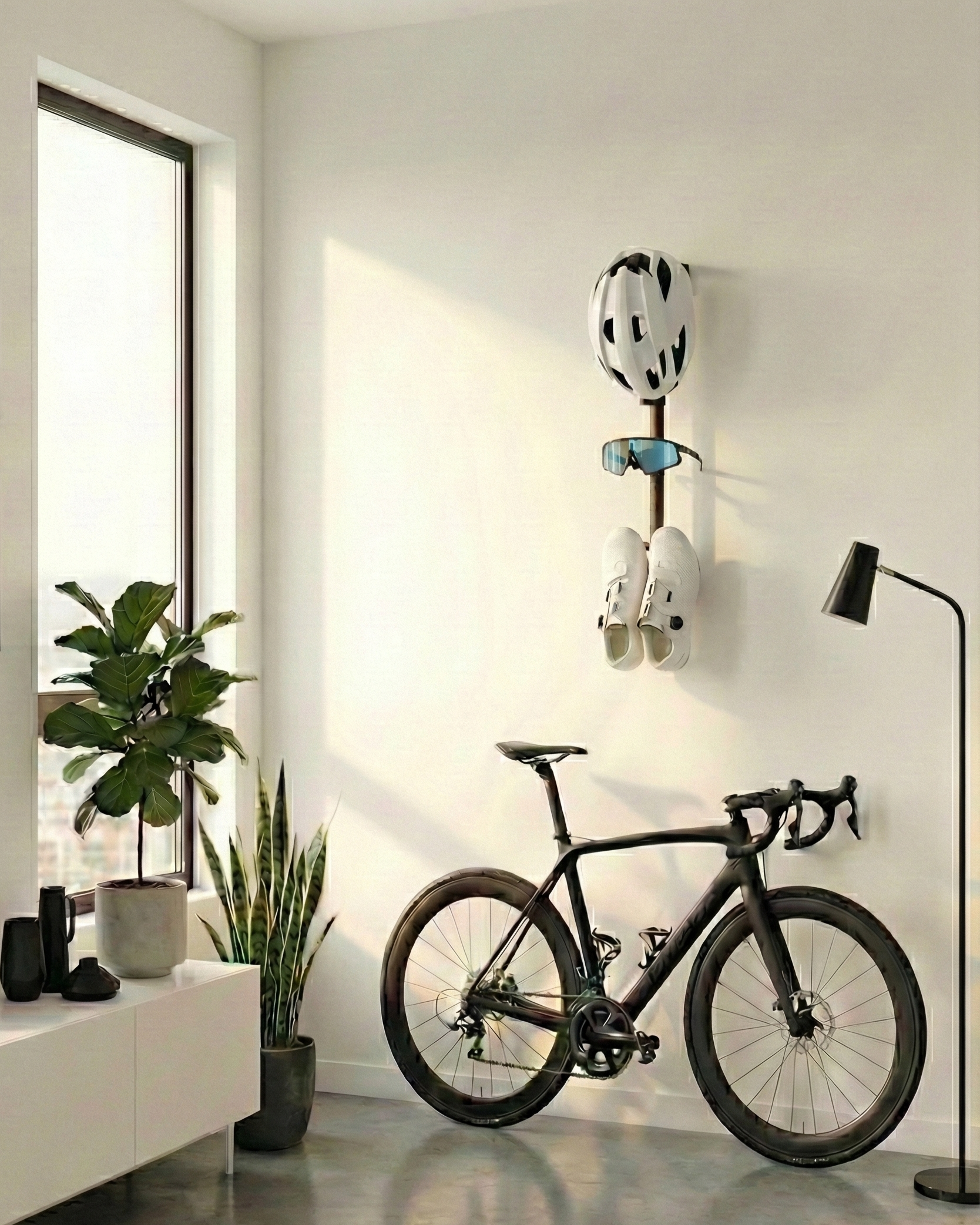 Full product rack mounted to a wall in a modern white apartment with black trim, houseplants, and a black bike against the wall. There is a white helmet, blue sunglasses, white shoes on the rack.
