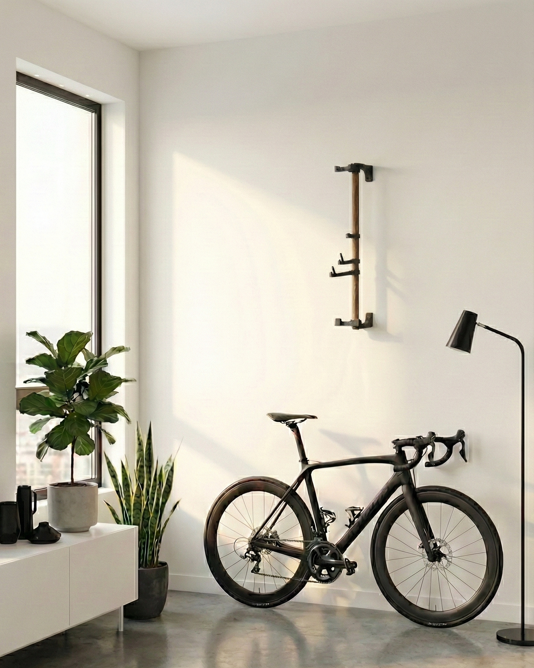 Empty product rack mounted to a wall in a modern white apartment with black trim, houseplants, and a black bike against the wall. 